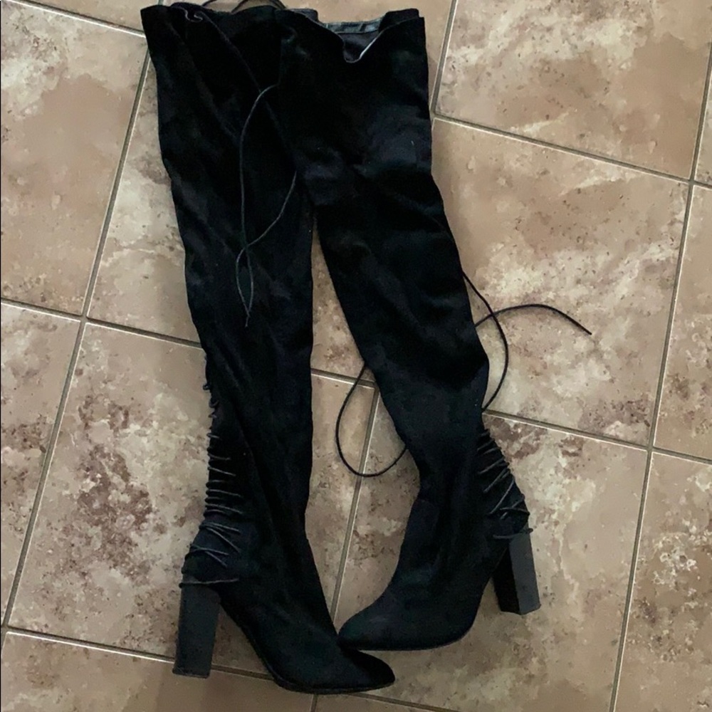 Thigh high heeled boots